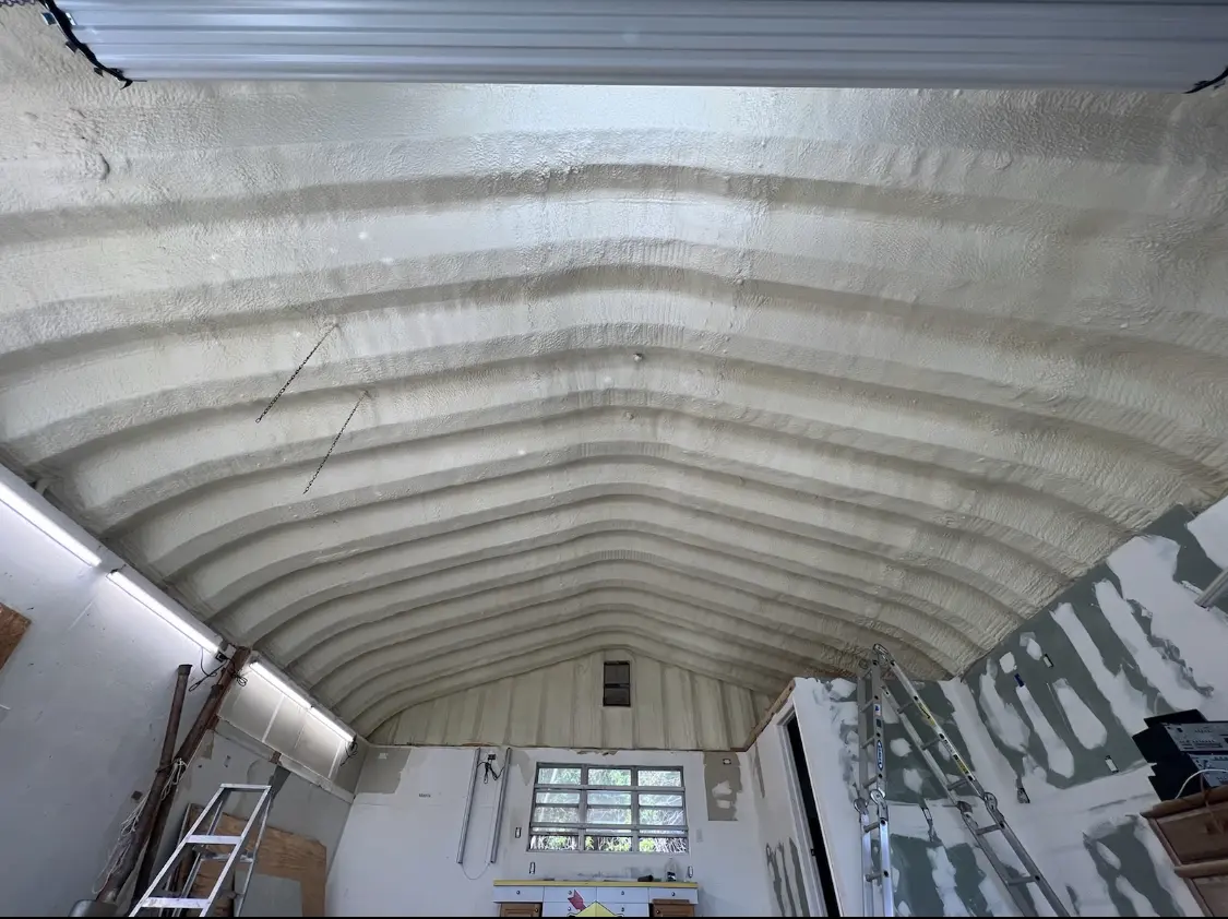 Spray polyurethane foam applied to the underside of a metal roof deck in Lakehills